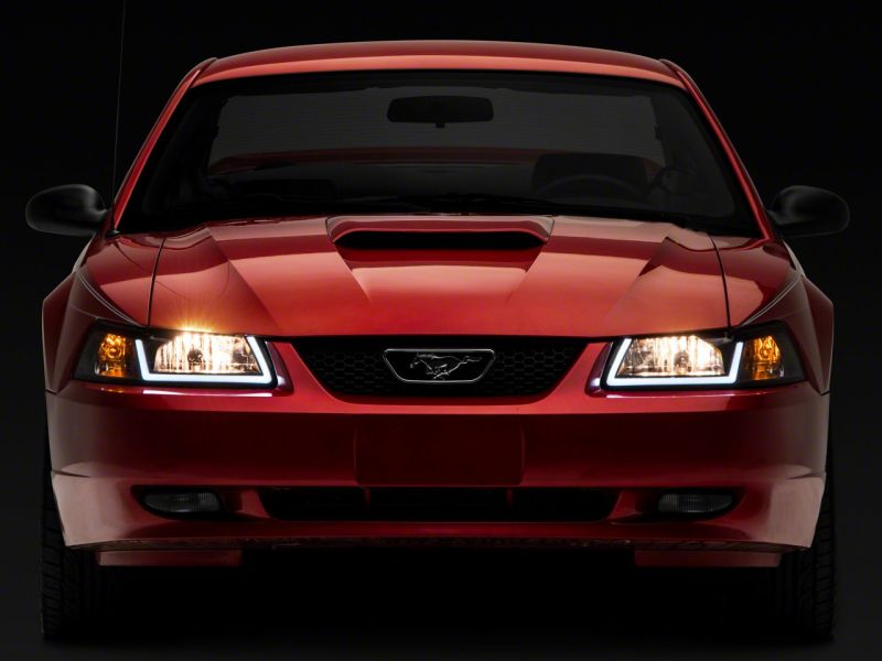 Raxiom 99-04 Ford Mustang Axial Series Headlights w/ LED Bar- Black Housing (Clear Lens)