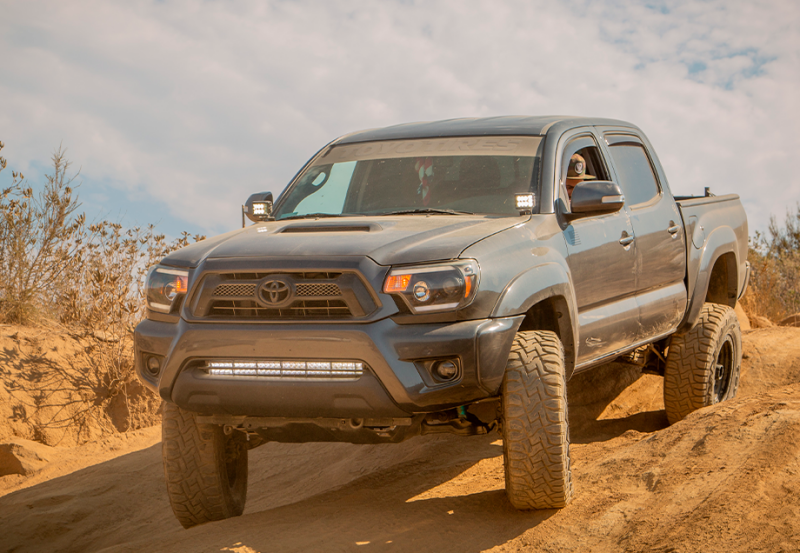 Cali Raised LED Cali Raised 05-15 Toyota Tacoma Low Prof Ditch Light Brackets Kit W/Can Pods Blue Backlight - Small
