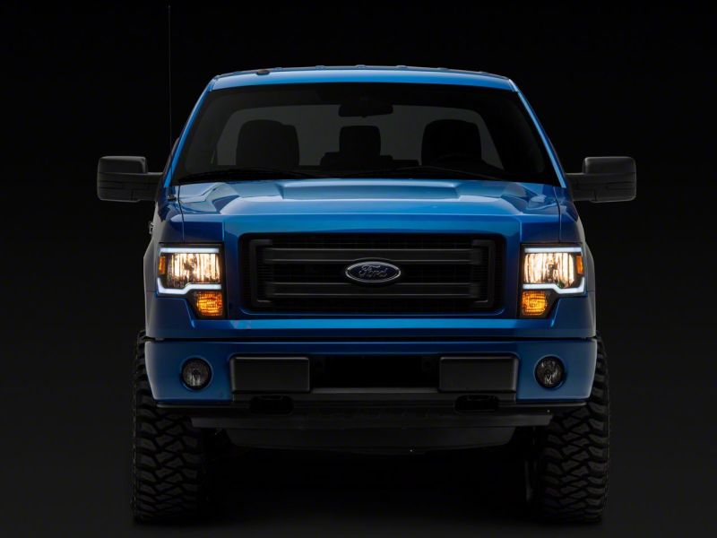 Raxiom 09-14 Ford F-150 Axial Series Headlight w/ SEQL LED Bar- Black Housing (Clear Lens)