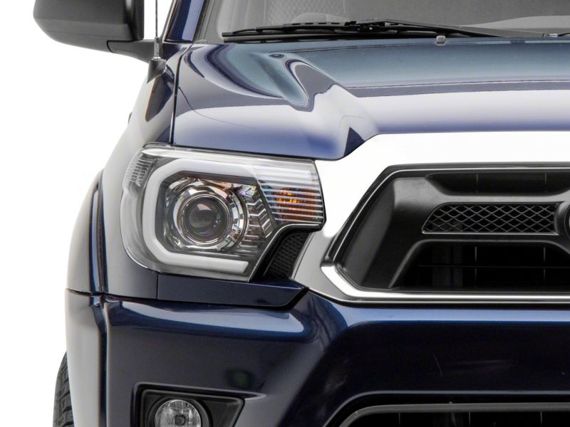 Raxiom 12-15 Toyota Tacoma Axial Series Projector Headlights w/ LED Bar- Black Housing (Clear Lens)
