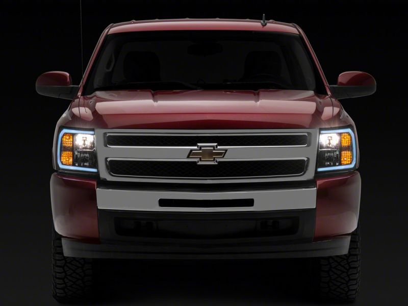Raxiom 07-13 Chevrolet Silverado 1500 Axial Series Headlights w/ LED Bar- Black Housing (Clear Lens)