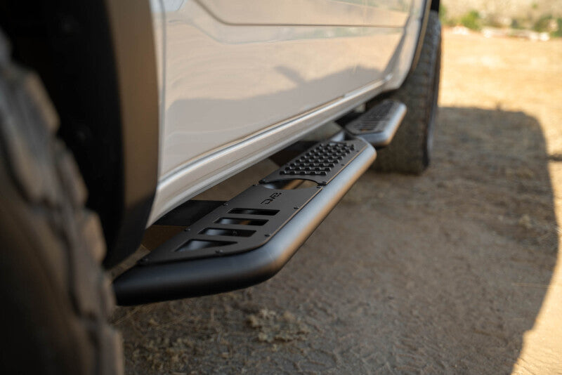 DV8 Offroad 19-25 RAM 1500 Crew Cab OE Plus Side Steps - Black Steel