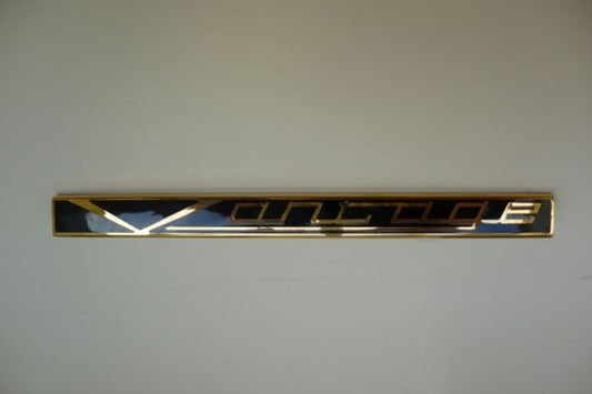 Aston Martin 095-078-0010 Vantage Badge Gold and Black | ML Performance US Car Parts